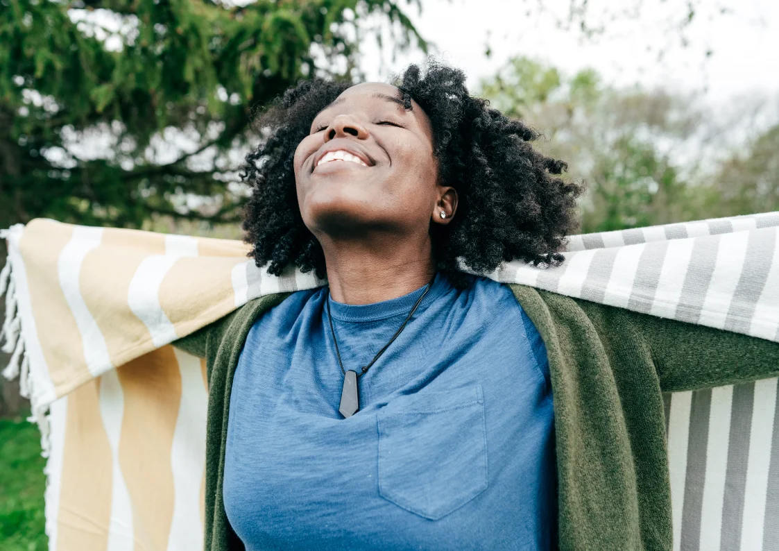 Woman expressing emotional freedom and wellbeing after EQness psychotherapy session in Sydney