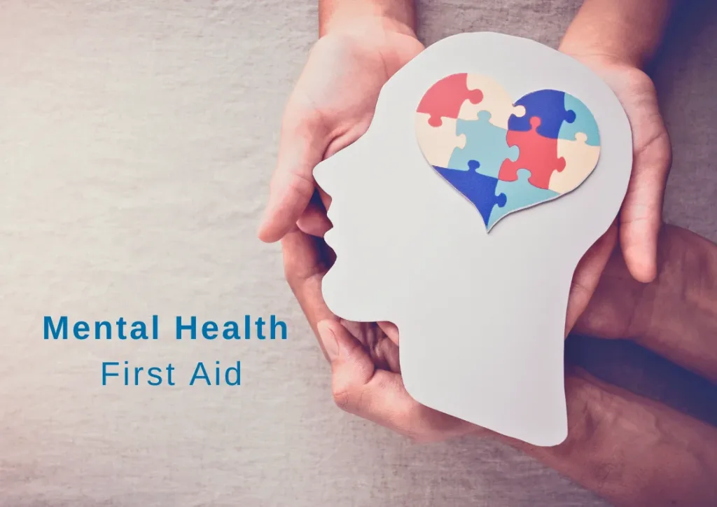 Hands holding a head with a heart in the middle representing mental health. Indicating the importance of Mental Health First Aid