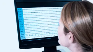 Woman observing eeg data