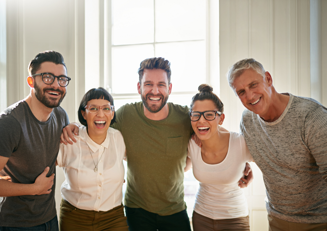 Team participating in EQness workplace wellbeing workshop, focused on emotional intelligence coaching and mindfulness in a supportive, inclusive environment