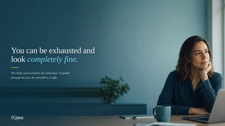 Thoughtful woman at her desk &mdash; the physical signs of stress and exhaustion